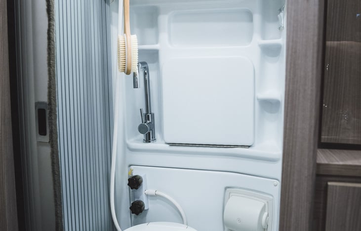 The conveniently placed full Wet Bath offers a toilet, shower, and sink with plenty of storage to accommodate your everyday bath products. Another feature that supports off the grid camping.