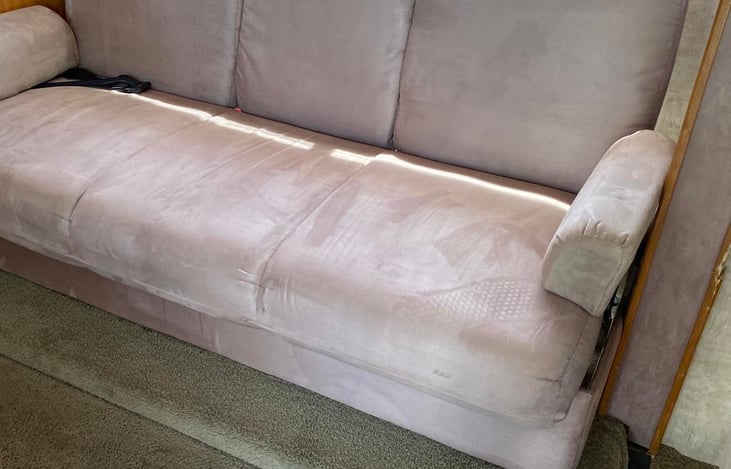 Couch has two seat belts and can turn into a bed