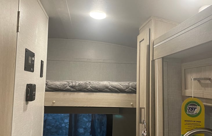 Wall thermostat for heater and AC, kitchen cabinets.