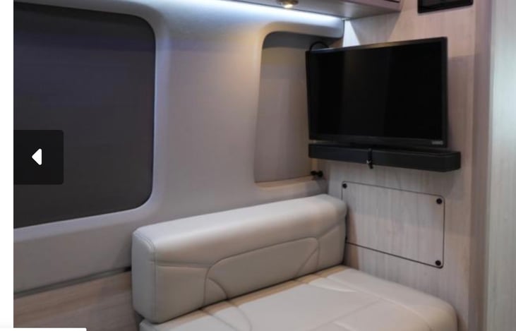Rear entertainment.. Smart TV with a sound bar, mixed with automatic black out shades.... Nice!