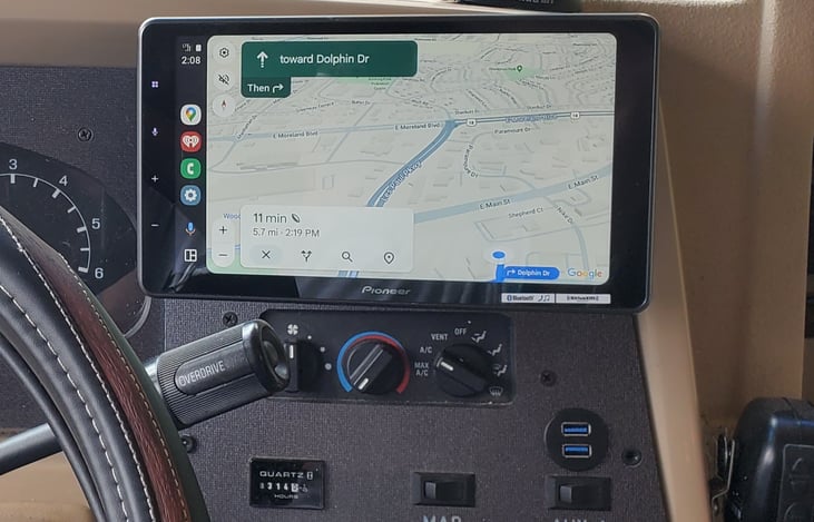 Indash touch screen media center with Android auto, and Apple play, and dash mounted usb inputs and charging ports.