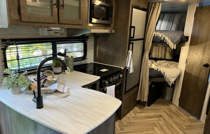 All kitchen utensils included. Automatic ice maker is a luxury must to cut down on ice trips into town.