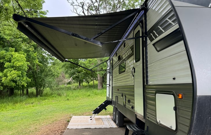 Electric roll out awning to catch some shade from the heat of the day!