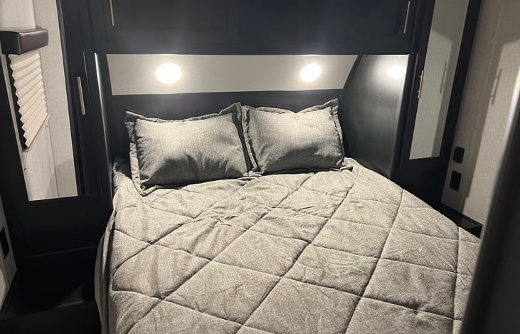 Queen bed with plenty of storage on both sides, above and one larger closet in front. (Not in picture)