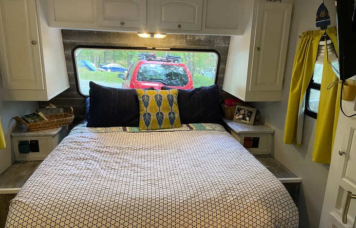 Updated queen size mattress, overhead and under the bed storage as well has two closets.