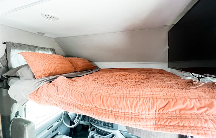 Second queen-size bed above cab