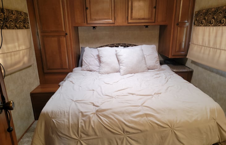 Queen size bed with top padding for extra comfort.