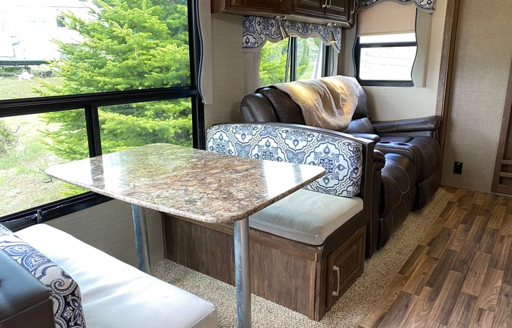 Dining Table folds into bed, Living room couch reclines into a comfortable place to relax or sleep.