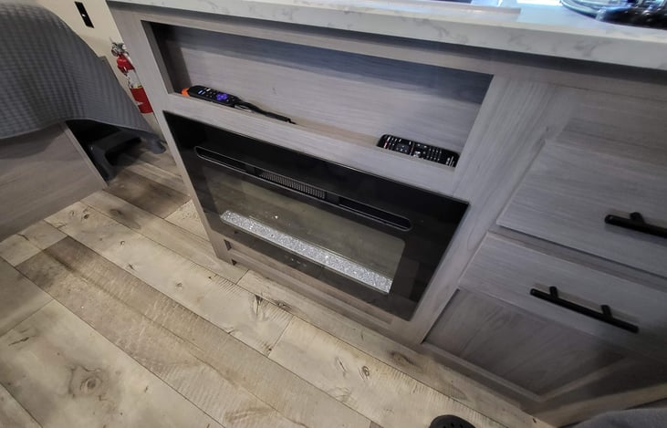 Electric fireplace, but can also be run for just ambient light (no heat). Requires shore power to function