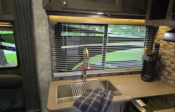 Deep basin kitchen sink without covers.