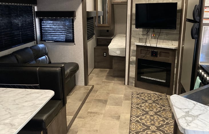 Main cabin with entry into the bedroom. The bedroom has a door that can be closed.