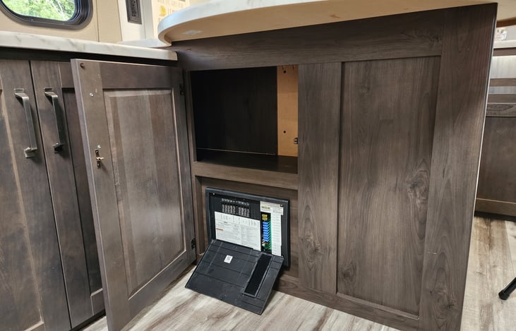 Storage and fuse panel under the peninsula.