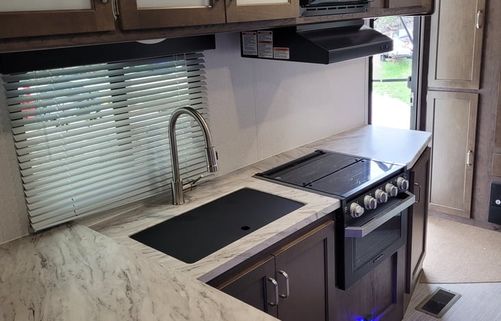 Kitchen with stove, oven, microwave