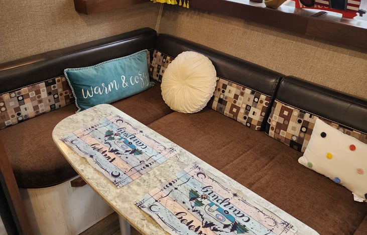 Dinette drops down to a full size bed.