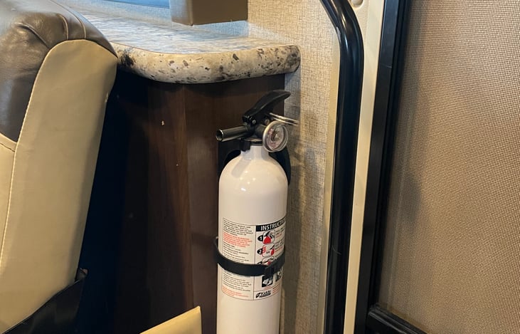 Fire extinguisher by door