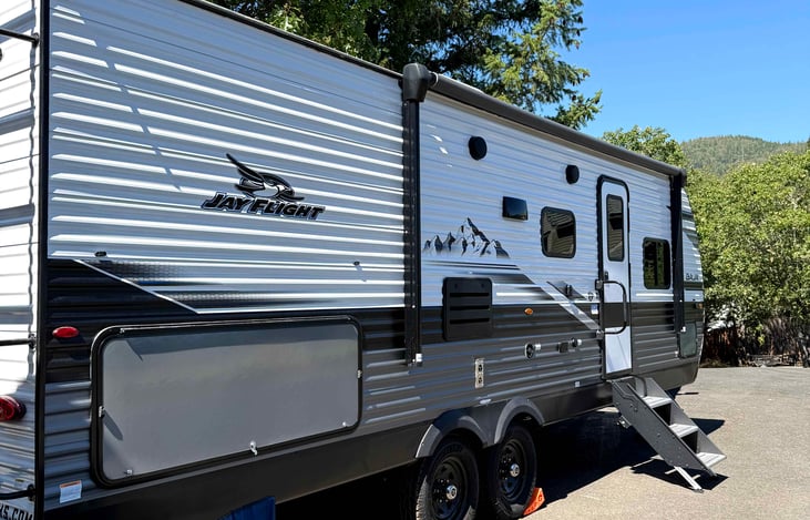 Awning, outdoor shower, along with an outdoor fridge 110 volt only.