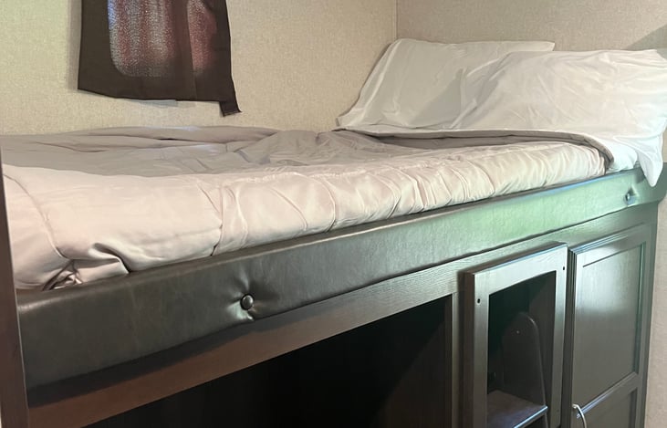 Double bed with storage under.