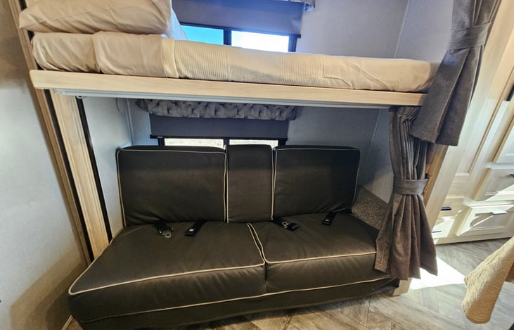 Flip down top bunk 28"x36" bottom bunk kids sofa sleeper back support slides down into a complete bed