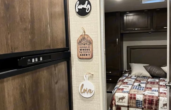 large refrigerator and freezer looking into master bedroom