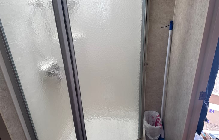Bathroom stand up shower with detachable shower head.