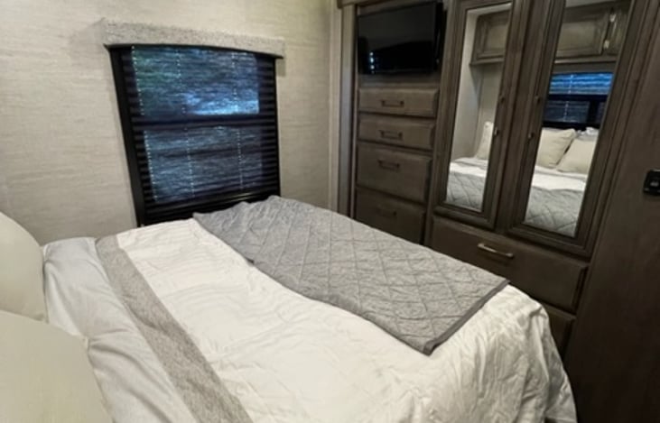 Master bedroom storage view with tv.