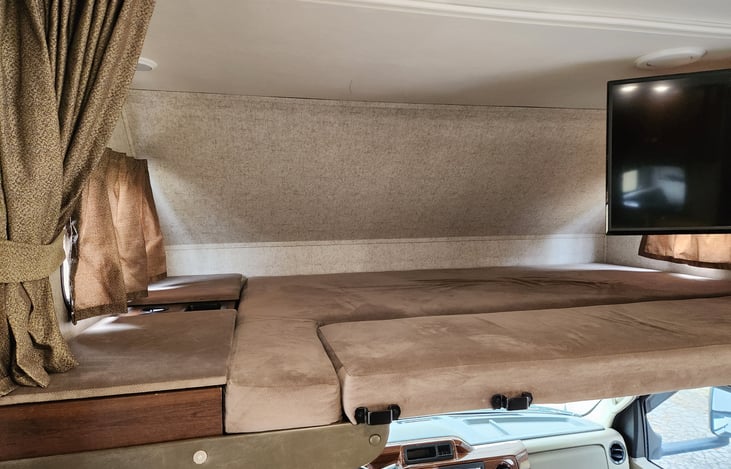 Area above the cab is larger than a queen bed and has plenty of room for for 2 adults