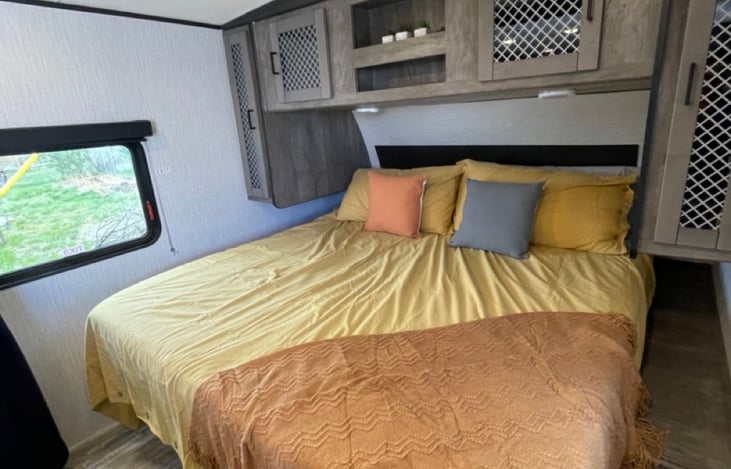 King size sleeping area with lots of clothing storage