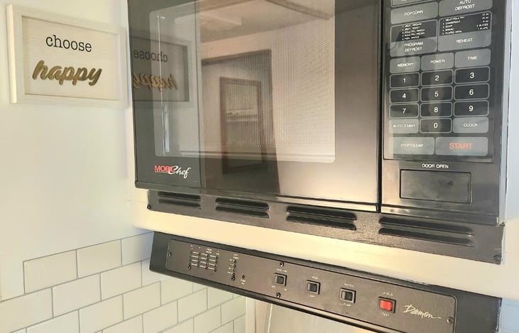 Microwave (electric hookup needed)
Water pump button, and where you check tank levels
*An extra 40-gallon tank installed in RV but leave levels low while driving to save on gas.