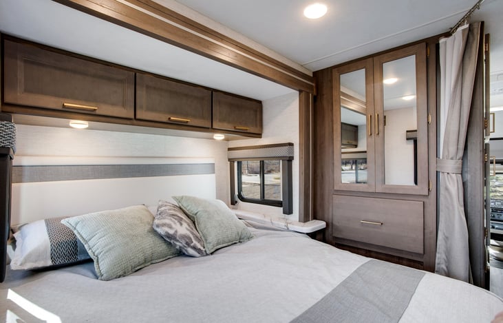 Clothes closet and drawers, extra overhead storage in Queen walkaround bedroom.