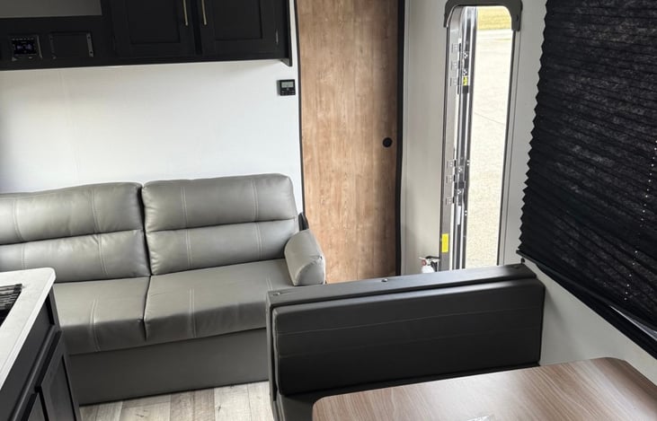 Couch and dining area convert to sleeping space