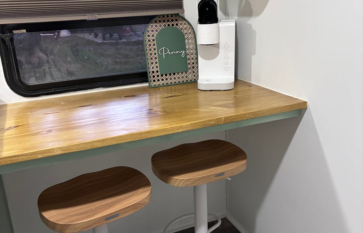 Breakfast bar seating for two and Keurig coffee maker. Stay includes hot chocolate and coffee pods.