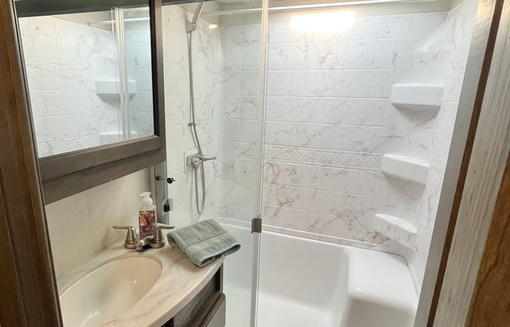 standing shower with moonroof/vent.