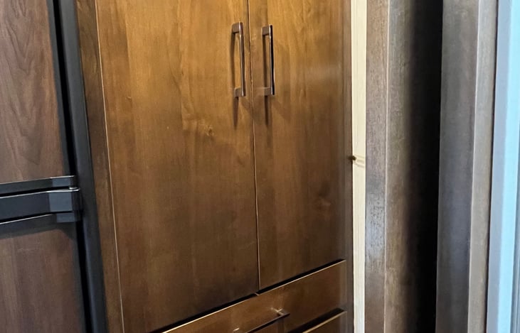 Closet and 2 drawers...more drawers under slide out bed and storage over bed