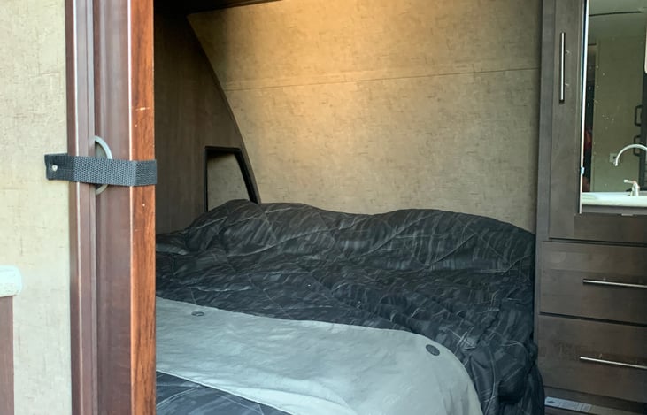 Main bedroom area with a queen bed