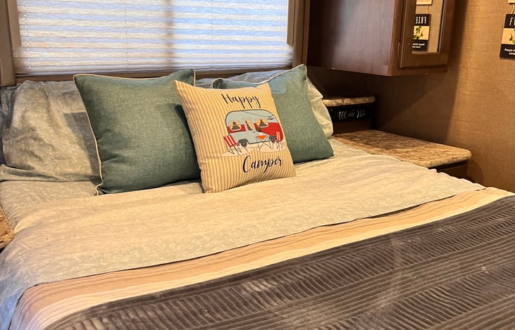 Queen-size bed in the rear of the RV