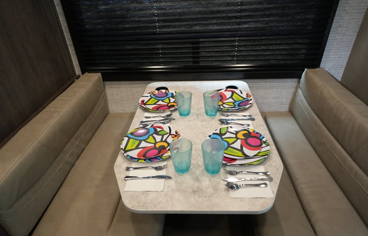 Nice dinette with 4 seat belts.  Can be converted into a bed or lounging sofa