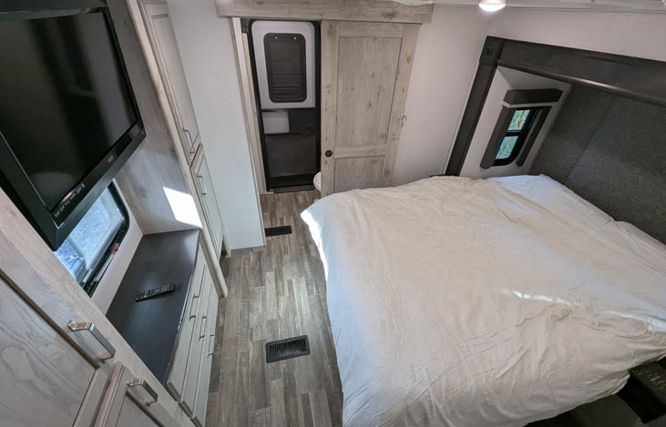 The ultimate guest retreat! This second master suite features a plush queen bed, massive wardrobe, and its own private full bathroom. Total privacy and comfort for friends or extended family.