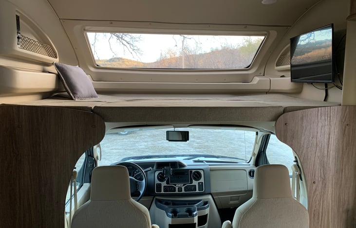 Long queen bunk over cab with panoramic window
