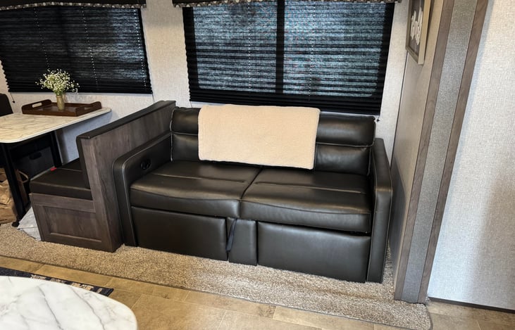 Couch pulls out for a sleeping area.