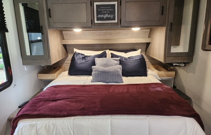 Main Bed with upgraded Queen mattress. Comes with pillows, sheets, and comforter.
