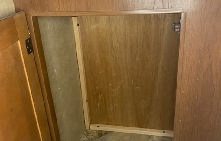 Front door area storage with fire extinguisher