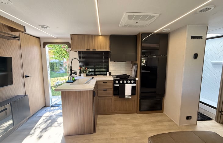 “Fully Equipped kitchen with stove, microwave & fridge.”