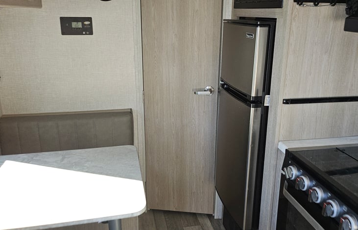 Large kitchen with fridge/freezer big enough for a long weekend of food n drink storage.  Kitchen table converts to bed at night when needed.