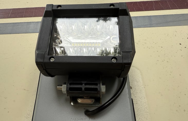 Sometimes technology wins over vintage -- that's why we chose to upgrade the porch light to an extremely bright LED, to give you light at night while loading and unloading the vehicle.