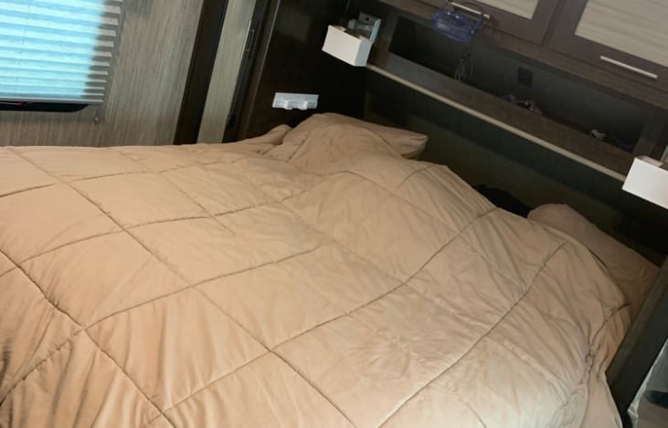 Queen bed in the separate bedroom with sliding door.