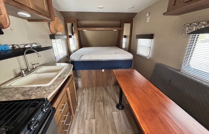 Seating changed to convert to a longer sleeping area, can fit 1-2 people on bed