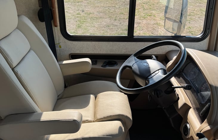 Captains seat. Turns backward for additional seating when parked.