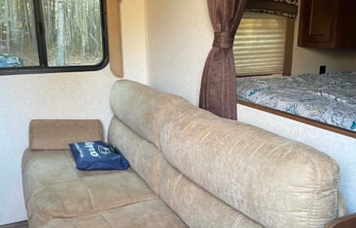 Couch for watching TV in main area.