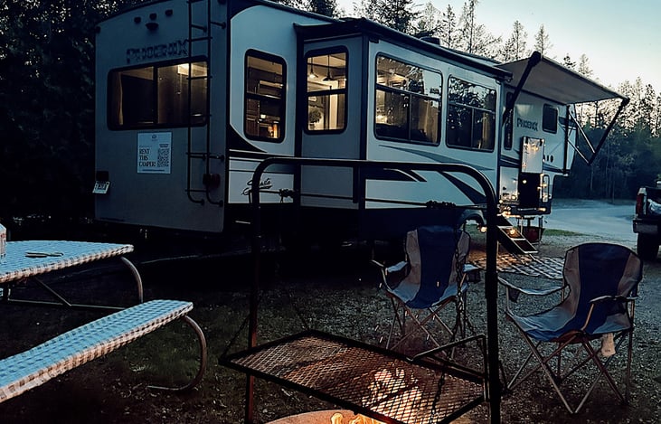 The perfect campsite setup!  Rental includes a camp kitchen, two chairs, and an outdoor rug.   You can also set up the optional twinkle lights for evening ambiance.
