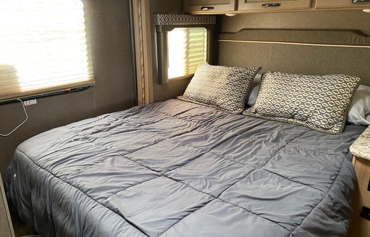 3 windows in the queen-sized bunk area provide plenty of light.  There's also a skylight.